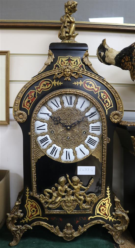 A Louis XV style ebonised eight day chiming mantel clock on matching stone, Clock H.75cm, Stand H.115cm